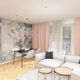 Pastelowy salon z tapetą w kwiaty, czarnym szklanym stołem, białymi krzesłami i narożną sofą. Na ścianie zegar. Podłoga w jodełkę.