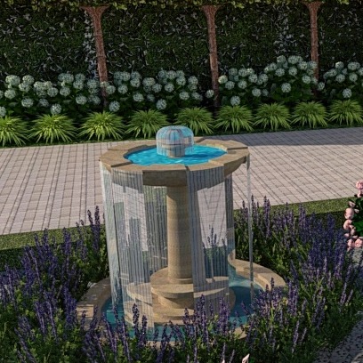 Ozdobna fontanna ogrodowa z elementami szklanymi, otoczona lawendą i innymi roślinami, na tle ściany z zielenią i brukowanego chodnika.