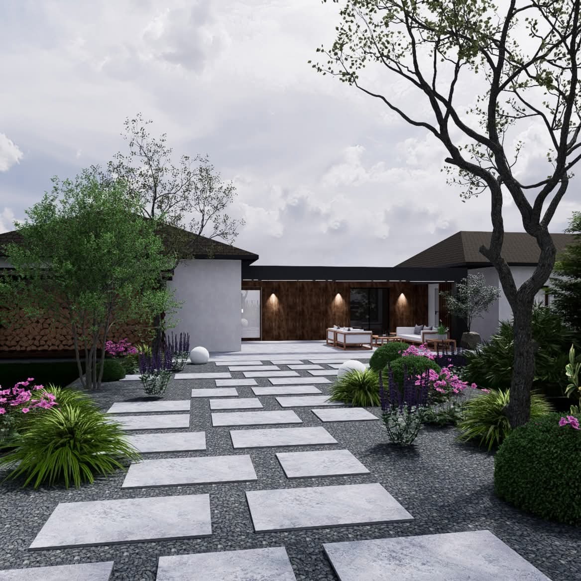 Nowoczesny ogród z geometrycznym chodnikiem z płyt, otoczony roślinnością i szarym żwirem. W tle budynek z drewnianą elewacją i oświetlonym tarasem.