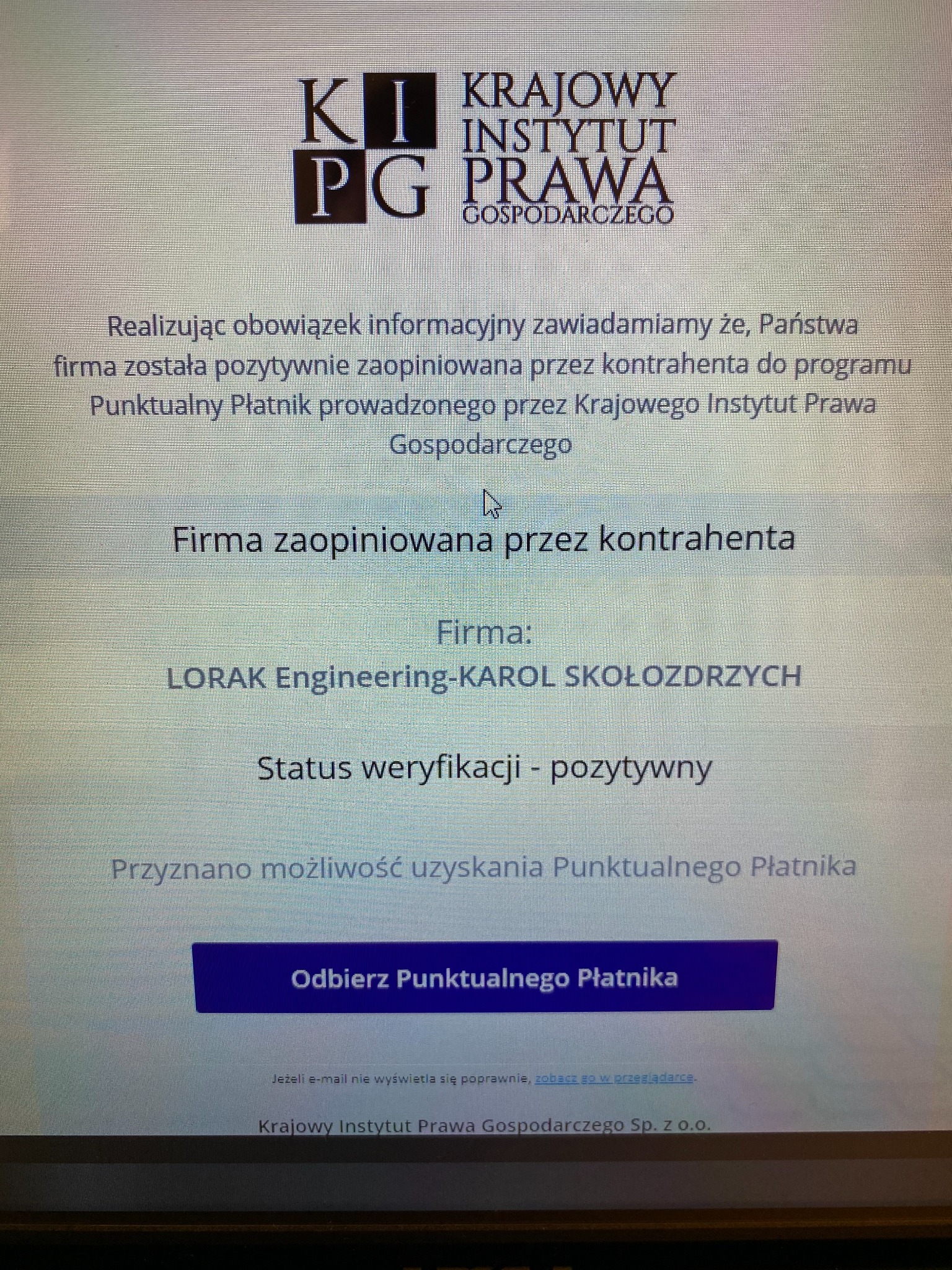 Powiadomienie o pozytywnej weryfikacji firmy LORAK Engineering-KAROL SKOŁOZDRZYCH w programie Punktualny Płatnik Krajowego Instytutu Prawa Gospodarczego, wyświetlone na ekranie komputera.