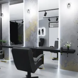 Nowoczesny projekt salonu fryzjerskiego w Łodzi: czarne fotele z złotymi akcentami, minimalistyczne stanowiska pracy z dużymi lustrami podświetlanymi pionowymi lampami, dekoracyjna ściana z półkami...