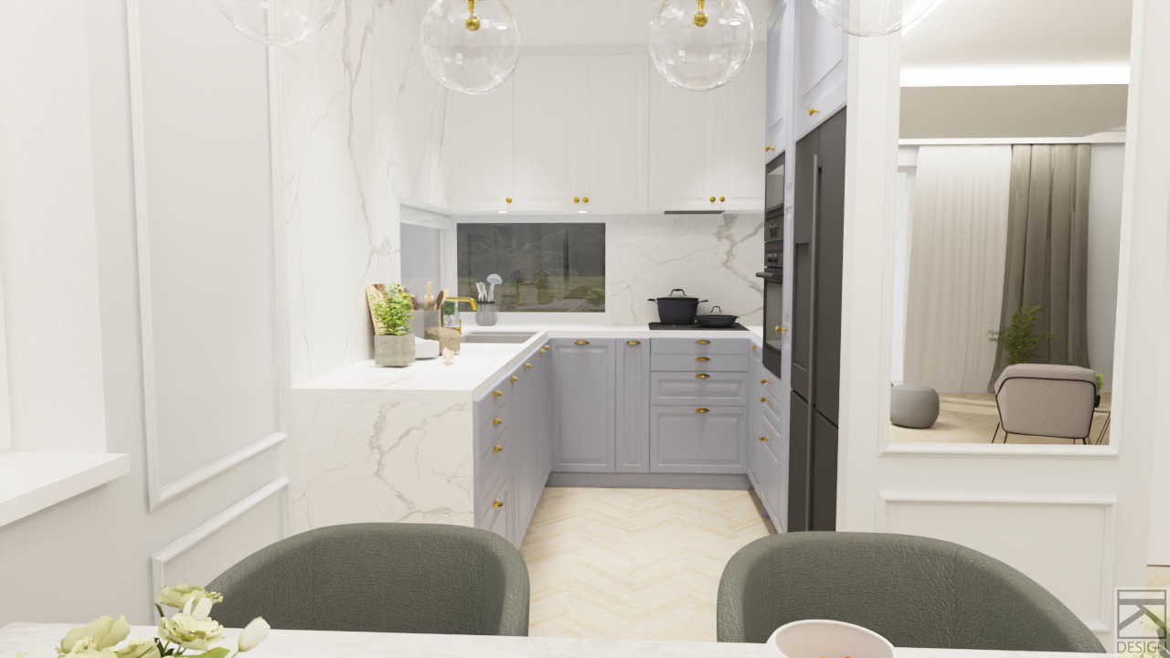 Elegancka kuchnia w jasnych odcieniach z frezowanymi frontami, złotymi uchwytami, marmurowym blatem i jasną podłogą ułożoną w jodełkę. W tle widoczne okno z widokiem na zieleń i przejście do salonu.