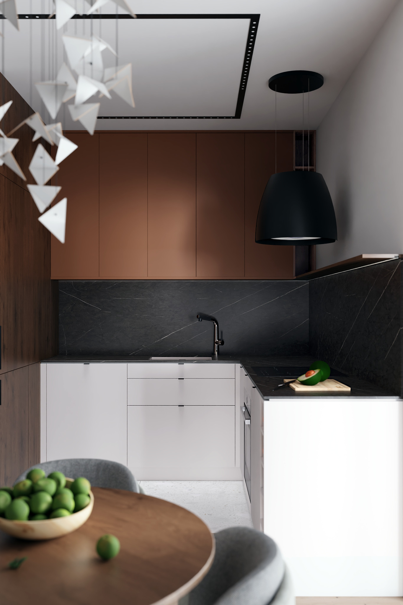 Wnętrze kuchni w Rzeszowie z elementami drewna, białymi szafkami i czarnym blatem, oświetlone nowoczesną lampą wiszącą. Na blacie leży przekrojone awokado na desce do krojenia, a na stole widać...