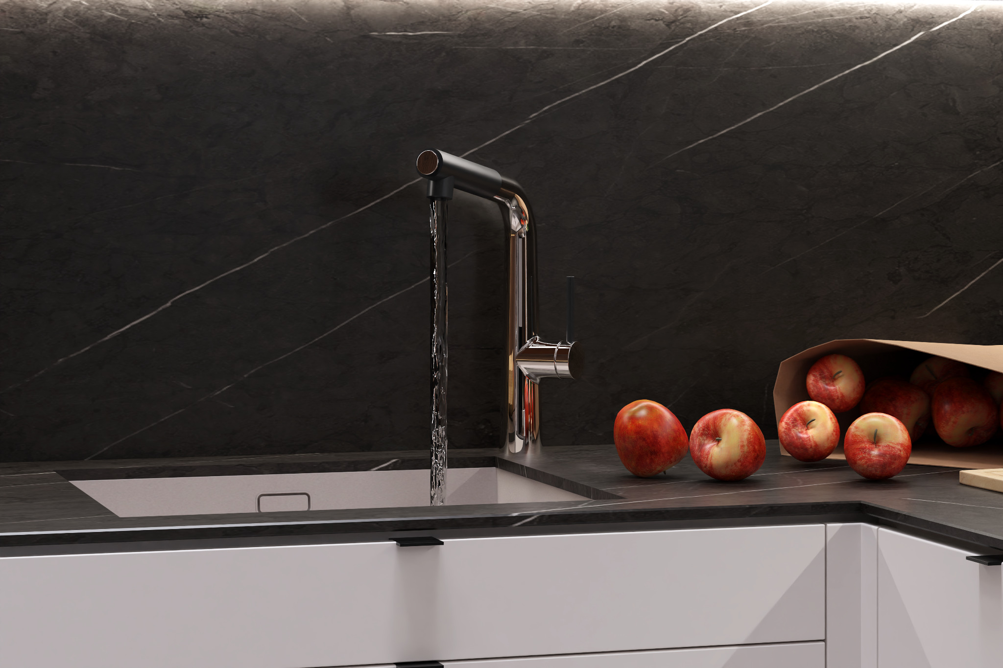 Nowoczesna kuchnia: chromowana bateria z wylewającą się wodą do zlewu, blat z czarnego marmuru z jabłkami obok papierowej torby z jabłkami, białe szafki z czarnymi uchwytami, czarny marmur...