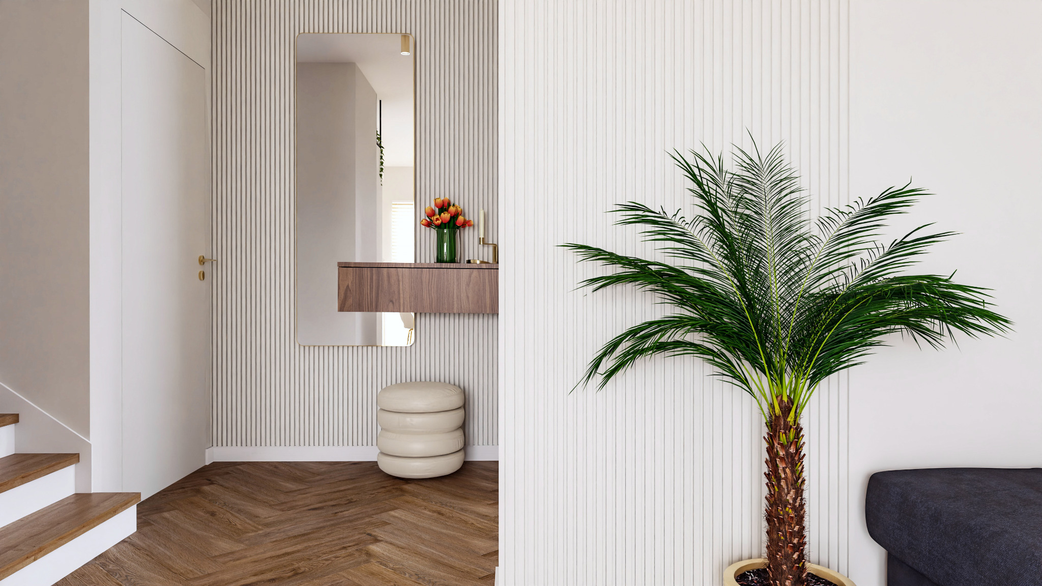 Nowoczesny przedpokój z drewnianą podłogą w jodełkę, konsolą z lustrem, pufem w kształcie walca i palmą w donicy.