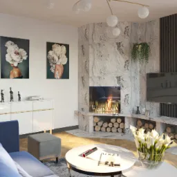 Salon z marmurowym kominkiem, płomieniami, drewnem, telewizorem na ścianie z lamelami, białymi kwiatami w wazonie na okrągłym stoliku kawowym i abstrakcyjnymi obrazami na ścianie.