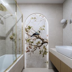 MSPROJEKT Michał Świerczek - Elegancka łazienka z wanną, deszczownicą w złotym kolorze, umywalką nablatową i dekoracyjnym panelem ściennym z motywem ptaka na gałęzi.