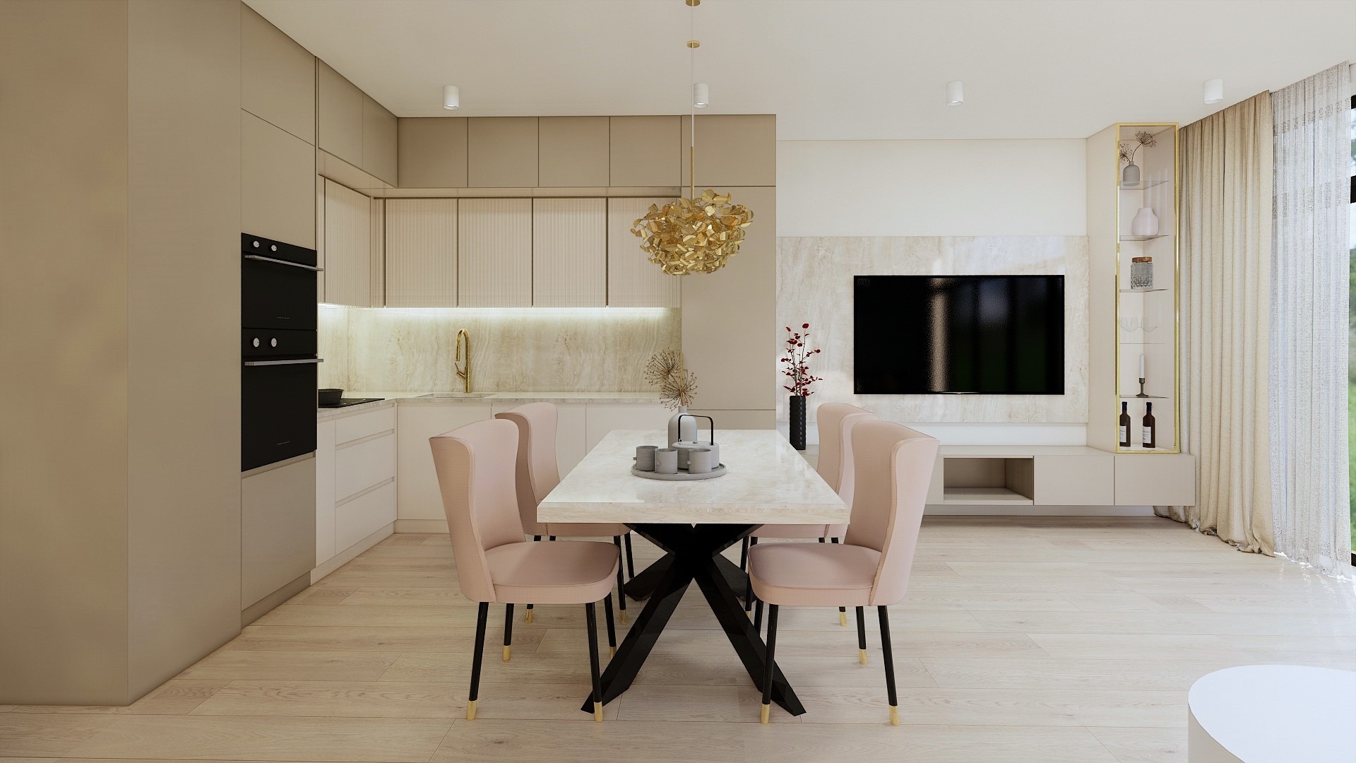 Jasne wnętrze jadalni połączonej z kuchnią, stół z marmurowym blatem i różowymi krzesłami, w tle zabudowa kuchenna w odcieniach beżu i telewizor na ścianie.