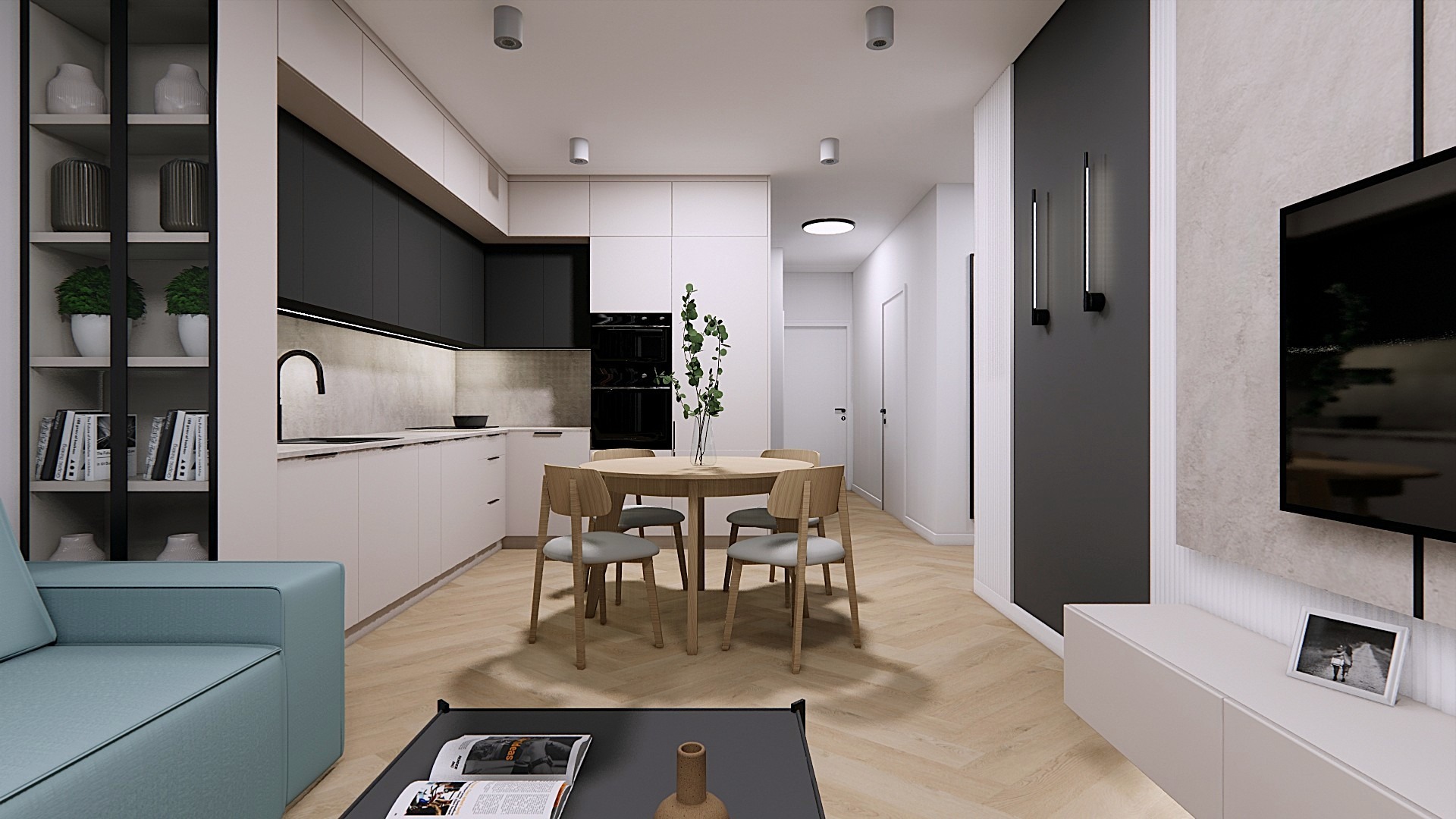 Wnętrze mieszkania: kuchnia z czarno-białymi szafkami, okrągły stół jadalny z drewnianymi krzesłami, salon z turkusową sofą i czarnym stolikiem kawowym. Parkiet w jodełkę.