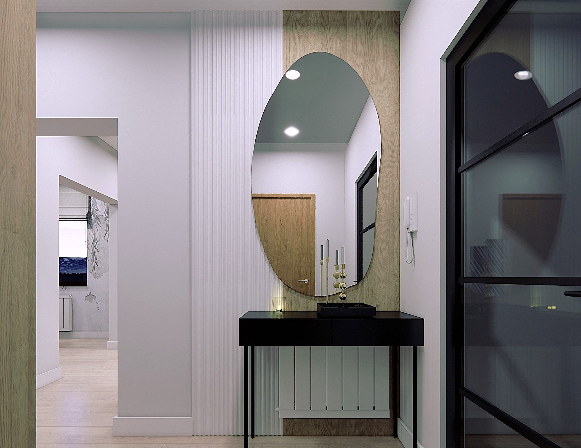 Nowoczesny przedpokój z owalnym lustrem w drewnianej ramie nad czarną konsolą. W tle widoczny fragment salonu z dekoracyjną ścianą i obrazem.