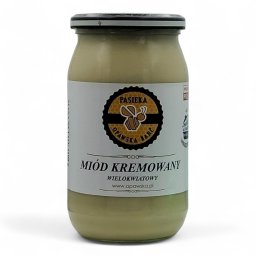 Pasieka Opawska Barć Bartosz Citak - Słoik kremowego miodu wielokwiatowego z pasieki Opawska Barć, z widocznym logo i etykietą na białym tle. Produkt gotowy do spożycia.