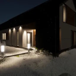 Nowoczesny dom jednorodzinny z płaskim dachem, oświetlony zewnętrznymi lampami w zimowej scenerii, z widocznym fragmentem tarasu i zaśnieżonym krajobrazem w tle.