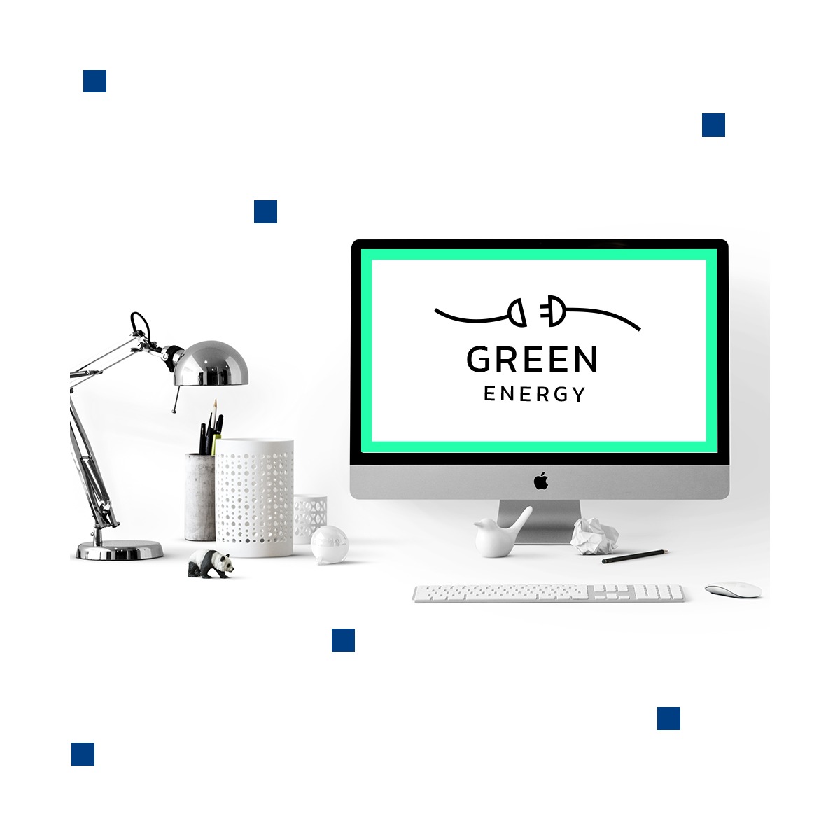 Monitor wyświetla logo 'Green Energy' z symbolem wtyczki, otoczony zieloną ramką, na minimalistycznym biurku z lampką, klawiaturą, myszką i dekoracyjnymi figurkami.