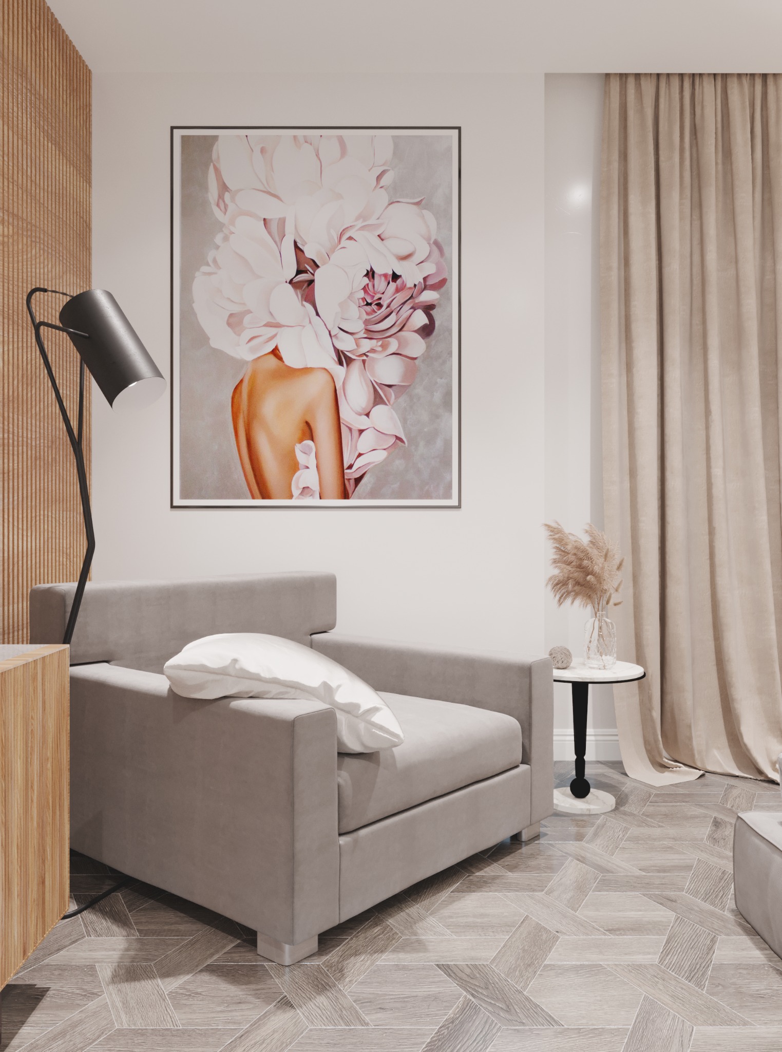 Neutralna aranżacja wnętrza z szarym fotelem, poduszką, lampą podłogową, stolikiem pomocniczym z suszonymi trawami i dużym obrazem kwiatowym na ścianie, na podłodze parkiet w jodełkę.