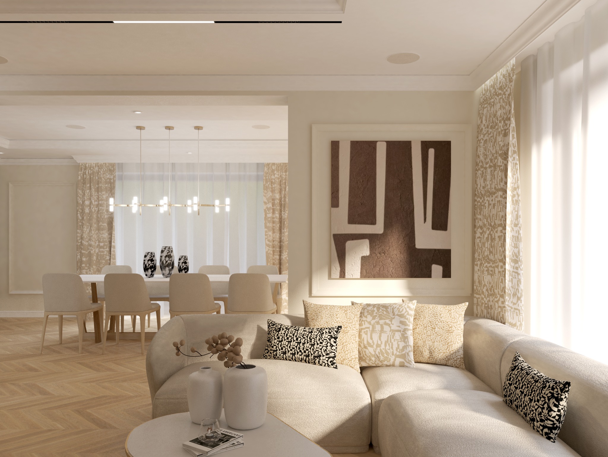 Jasne, przestronne wnętrze: salon z sofą w odcieniach beżu i dekoracyjnymi poduszkami, w tle jadalnia z krzesłami i nowoczesnym oświetleniem, na ścianie abstrakcyjny obraz w brązach.