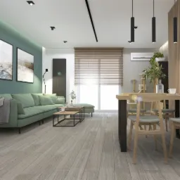 Nowoczesny salon z zieloną sofą, drewnianym stołem i krzesłami, oraz elementami dekoracyjnymi, takimi jak obrazy na ścianie i roślina w doniczce, oświetlenie punktowe i listwowe.