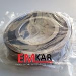 Nowe łożysko samochodowe w foliowym opakowaniu z widocznym logo EMKAR i adresem strony internetowej na opakowaniu.