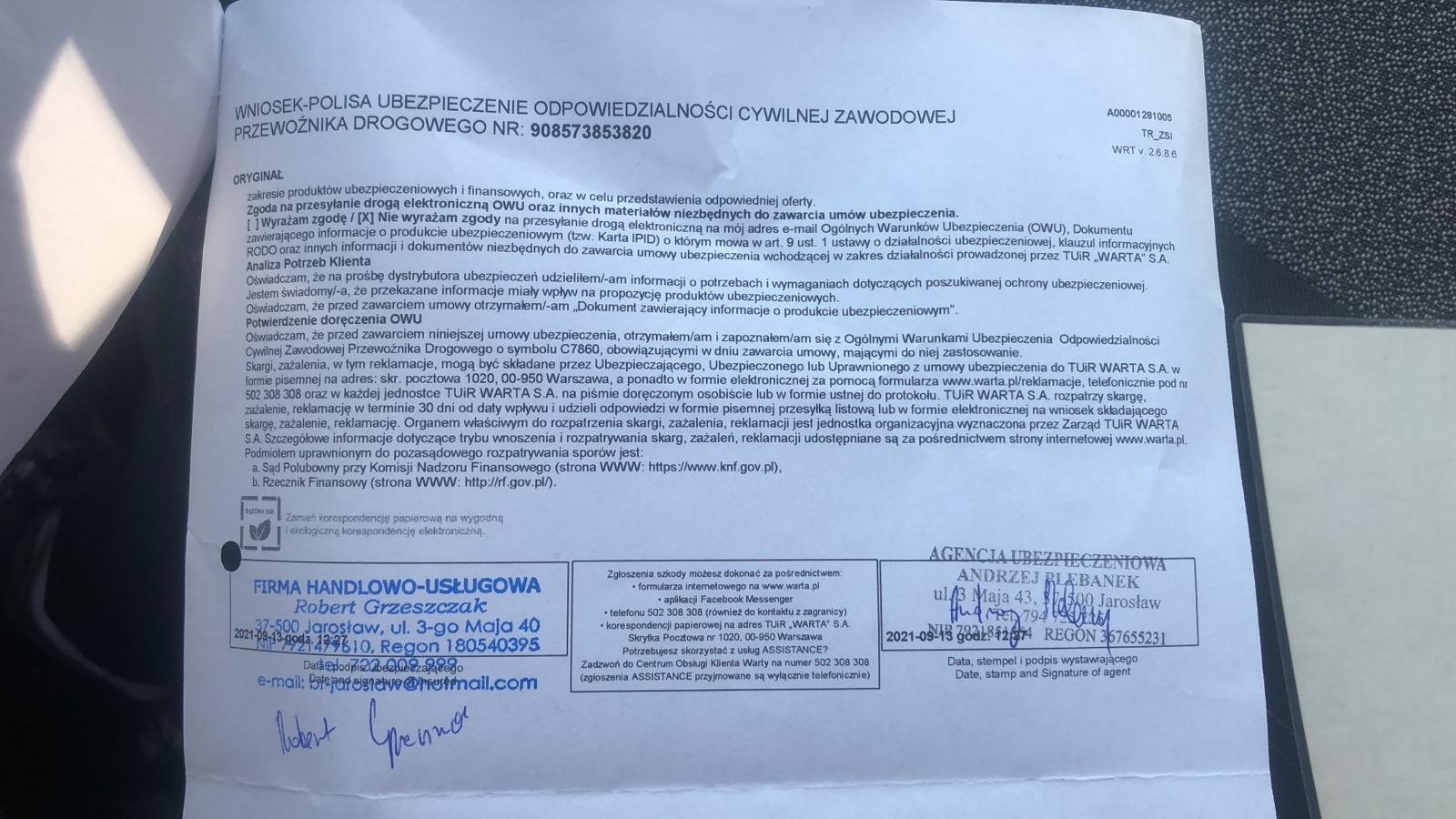 Skan polisy ubezpieczeniowej odpowiedzialności cywilnej przewoźnika drogowego, z widocznymi danymi firmy ubezpieczeniowej, numerem polisy, oraz pieczątkami i podpisami agentów ubezpieczeniowych.