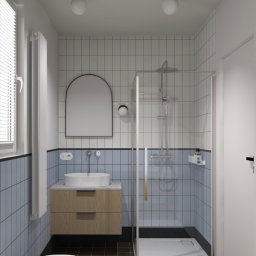 Piotr Krzeminski Pod Klucz - Nowoczesna łazienka z kabiną prysznicową, umywalką na szafce z drewnianym frontem i lustrem w kształcie łuku. Biało-niebieskie płytki, czarna podłoga i minimalistyczne oświetlenie.