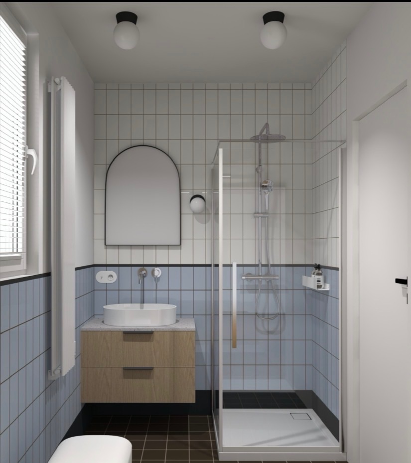 Nowoczesna łazienka z kabiną prysznicową, umywalką na szafce z drewnianym frontem i lustrem w kształcie łuku. Biało-niebieskie płytki, czarna podłoga i minimalistyczne oświetlenie.