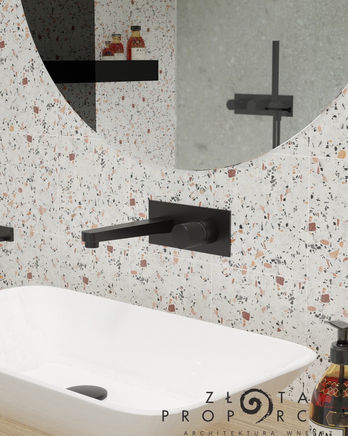 Nowoczesna łazienka z umywalką nablatową, czarną armaturą i płytkami w stylu terrazzo, odbicie kabiny prysznicowej w okrągłym lustrze.