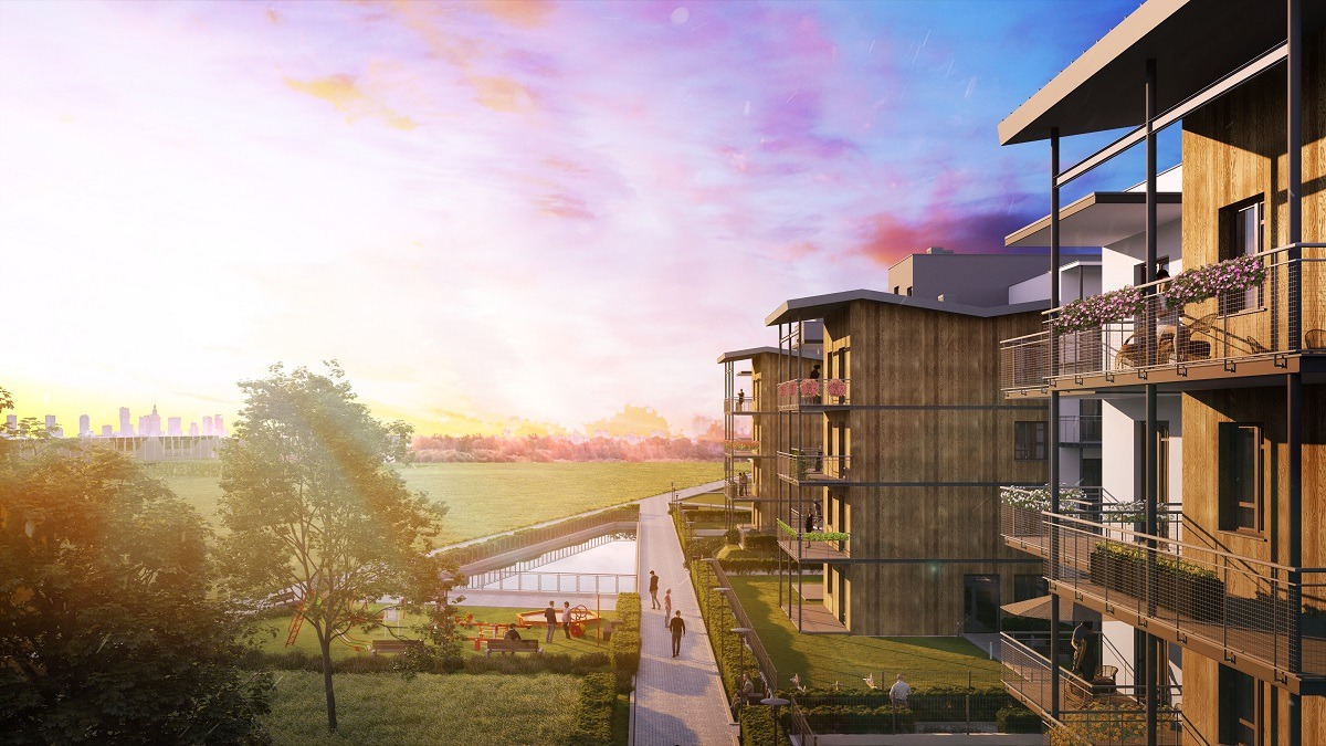 Wizualizacja nowego osiedla mieszkaniowego z balkonami w Warszawie, widok z perspektywy parku z placem zabaw i spacerującymi ludźmi, w tle panorama miasta o zachodzie słońca.