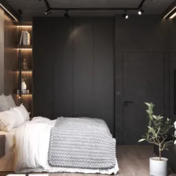 Sypialnia w ciemnych odcieniach z płytami z betonu arcitektonicznego