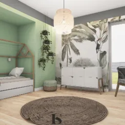 Pokój dziecięcy z łóżkiem w kształcie domku, zieloną ścianą, biurkiem z komputerem i tapetą z motywami tropikalnymi.