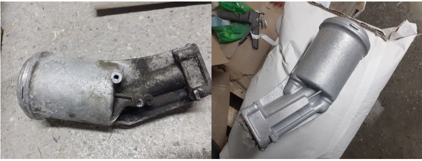 Porównanie elementu metalowego przed i po obróbce: po lewej stronie zanieczyszczony i zużyty, po prawej po piaskowaniu i malowaniu proszkowym, leżący na worku.