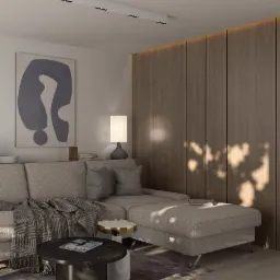 Jasnoszara sofa narożna z poduszkami i wzorzystym pledem, stolik kawowy z marmurowym blatem, abstrakcyjny obraz na ścianie i drewniana zabudowa z oświetleniem LED w tle, oświetlona ciepłym światłem...