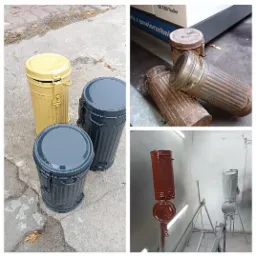 Metalowe pojemniki po piaskowaniu i malowaniu proszkowym: żółty, szary i rdzawy, widoczne etapy renowacji.