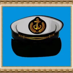 Kartonowa czapka kapitana z symbolem kotwicy i wieńca laurowego na niebieskim tle, w ozdobnej ramce.