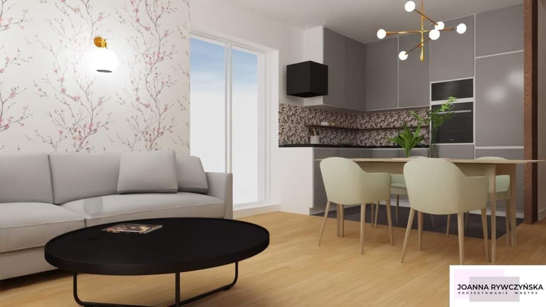 Wizualizacja wnętrza: salon z sofą, okrągłym stolikiem kawowym i jadalnią z krzesłami, kuchnia w tle z szarymi szafkami i czarnym okapem, ściana z tapetą w kwiaty, nowoczesne oświetlenie.