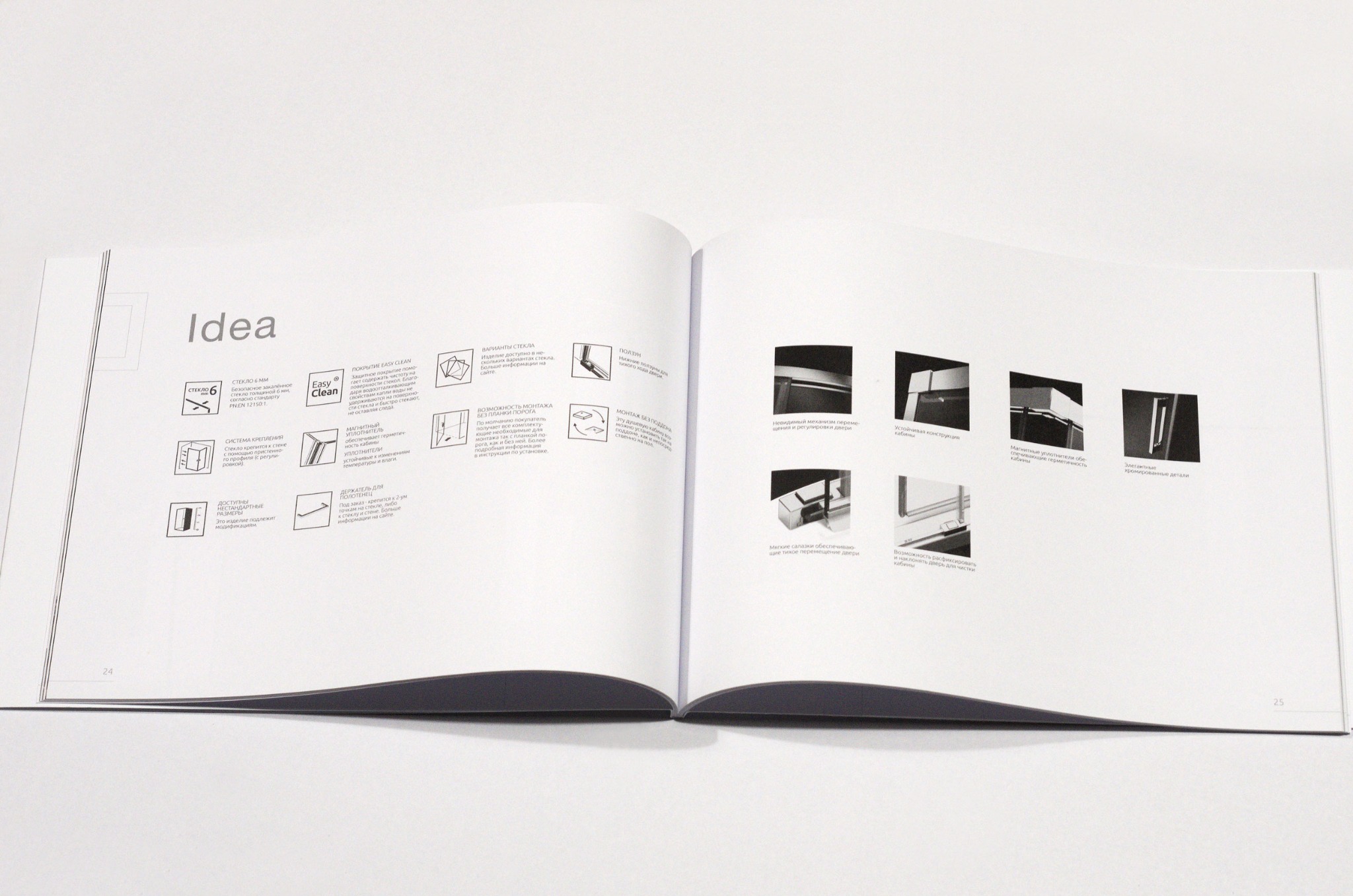 Otwarta broszura reklamowa z ilustracjami i opisami detali kabiny prysznicowej, prezentująca różne warianty montażu, rodzaje szkła, systemy mocowania i uszczelnienia.