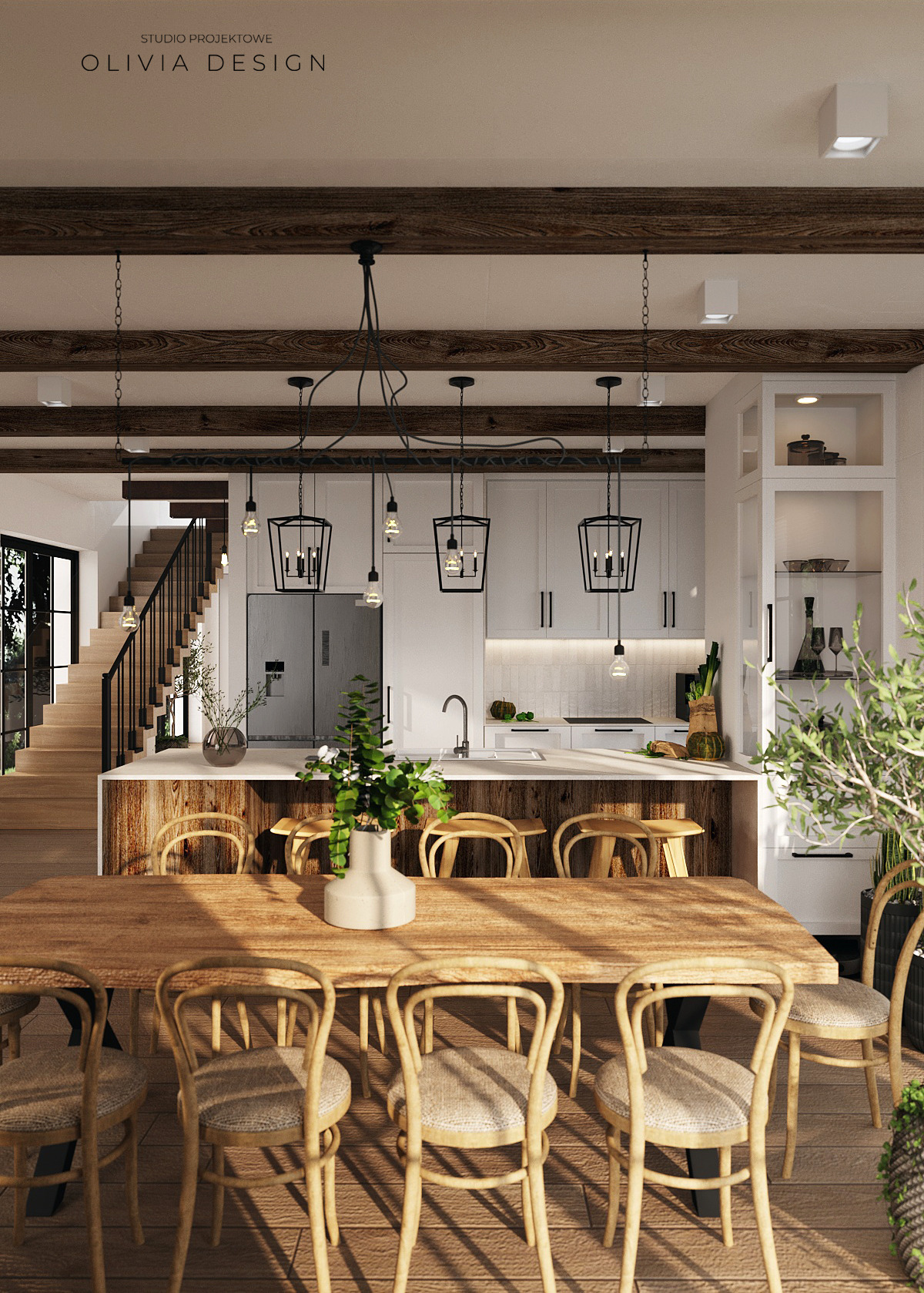 Wnętrze jadalni z drewnianym stołem, krzesłami z plecionki i widokiem na kuchnię z białą zabudową oraz drewnianymi belkami sufitowymi i schodami w tle.