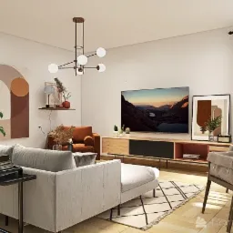 Jasny salon z szarą sofą, czarnym stolikiem z książkami i roślinami, telewizorem, drewnianą szafką RTV, okrągłym stołem jadalnym z krzesłami z poduszkami oraz abstrakcyjnymi obrazami na ścianach.