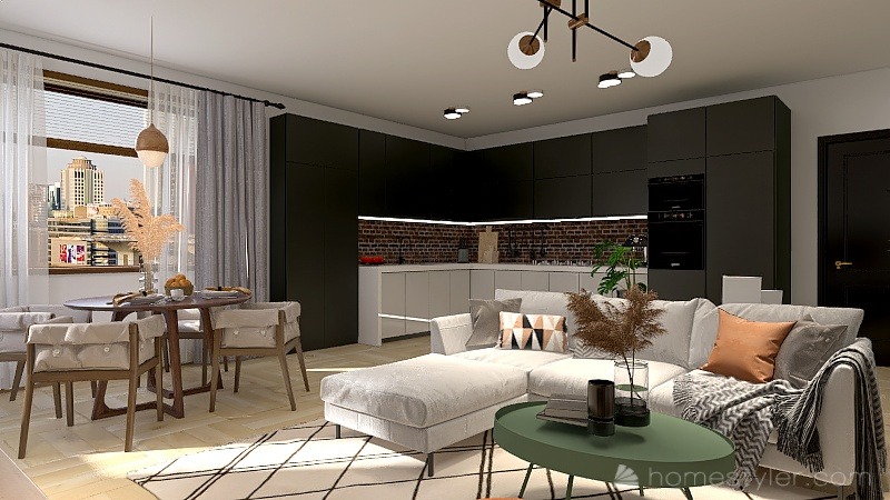 Wnętrze mieszkania z aneksem kuchennym, okrągłym stołem jadalnym i narożną sofą na tle zabudowy kuchennej z ceglaną ścianą.