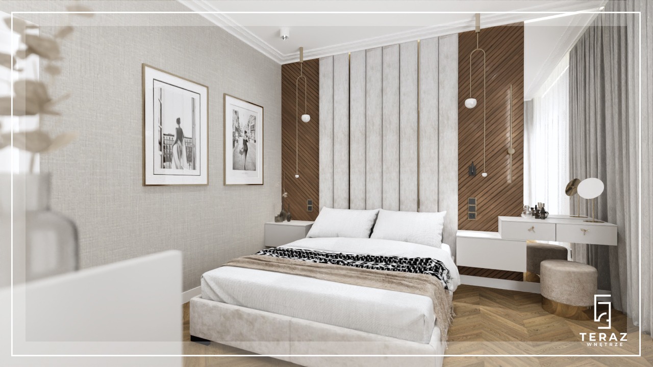 Elegancka sypialnia w neutralnych barwach z łóżkiem z tapicerowanym wezgłowiem, stolikami nocnymi, toaletką z lustrem i dwoma obrazami w złotych ramach na ścianie.