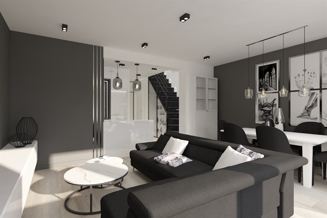 Wizualizacja salonu z aneksem kuchennym w odcieniach szarości i bieli, z czarną sofą narożną, marmurowym stolikiem kawowym i schodami w tle.