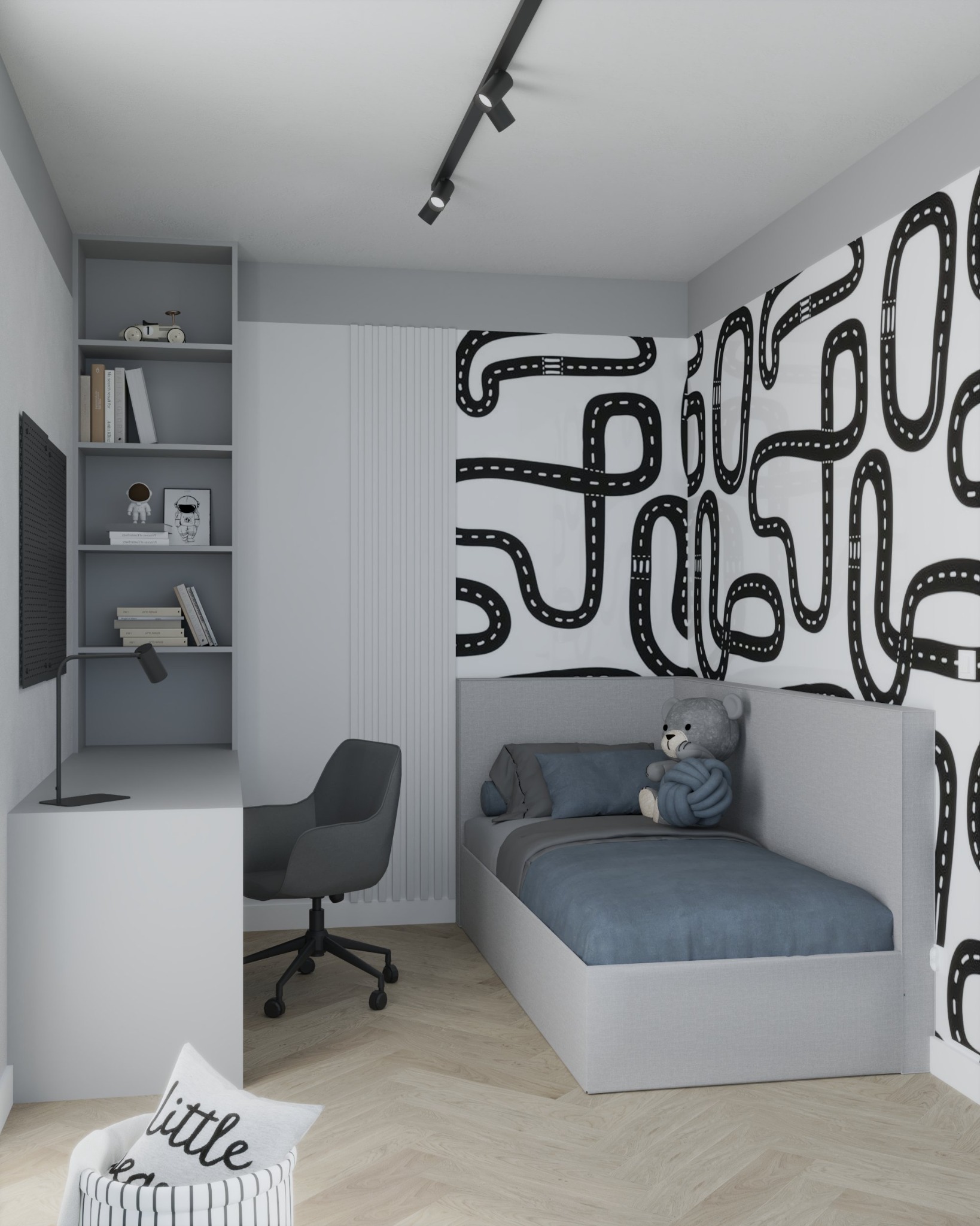 Pokój dziecięcy w szarościach z łóżkiem, biurkiem i regałem. Na ścianie tapeta z motywem toru wyścigowego, na łóżku pluszowy miś.