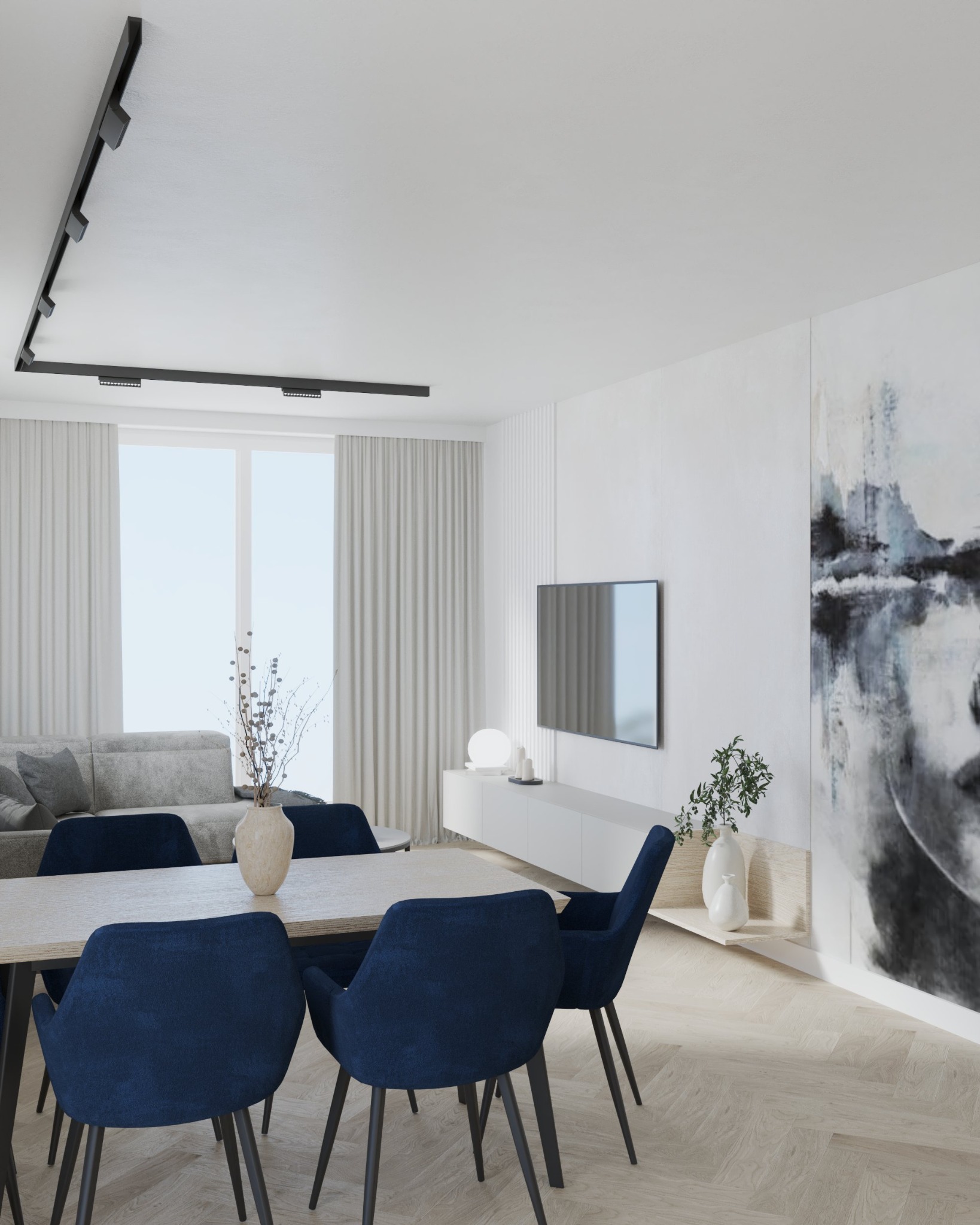 Wnętrze salonu z jadalnią, minimalistyczny design, stół z ciemnoniebieskimi krzesłami, abstrakcyjny obraz na ścianie, oświetlenie szynowe.