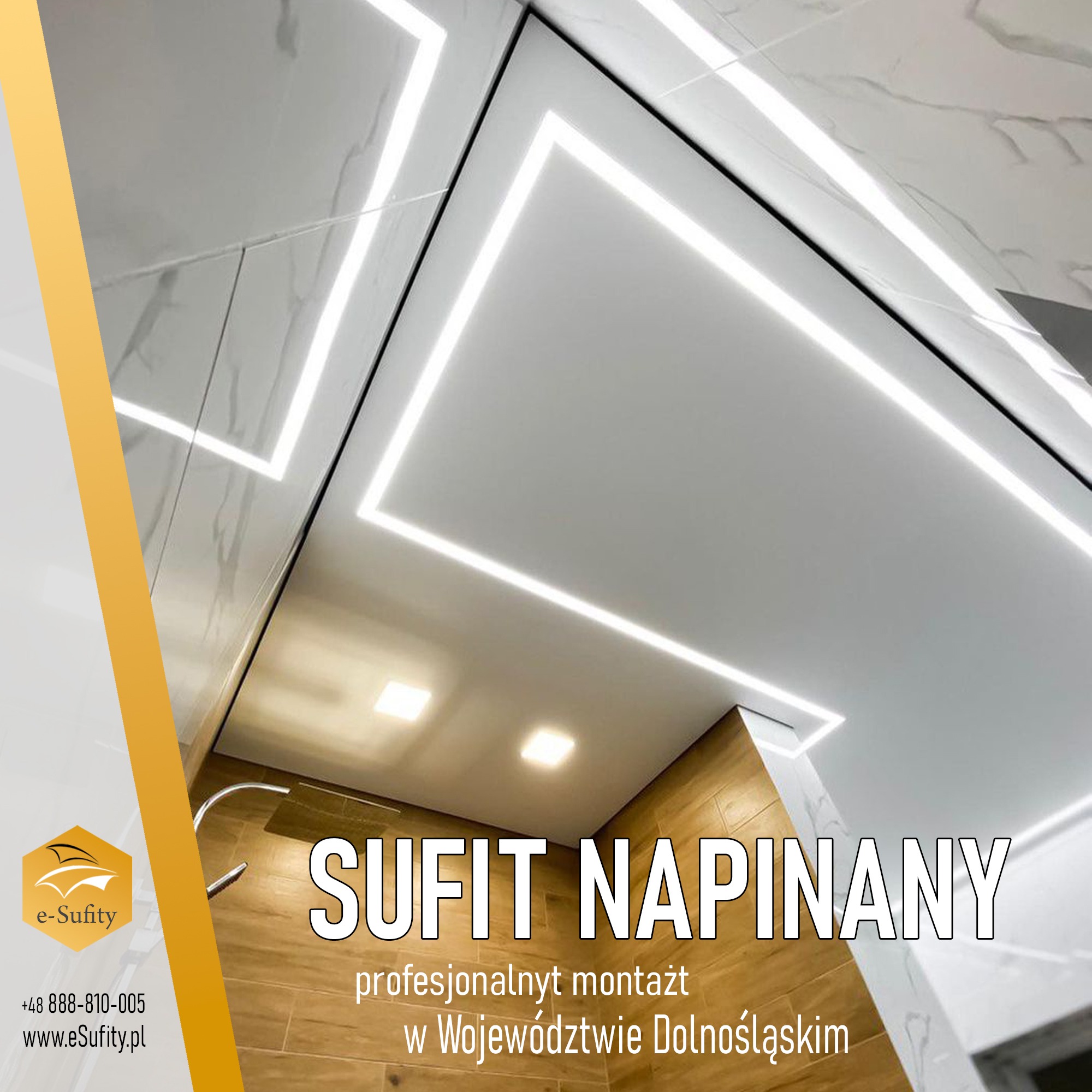 Nowoczesna łazienka z podwieszanym sufitem i liniowym oświetleniem LED, wykończona marmurowymi płytkami i drewnopodobną okładziną ścienną, z widocznym logo firmy e-Sufity.