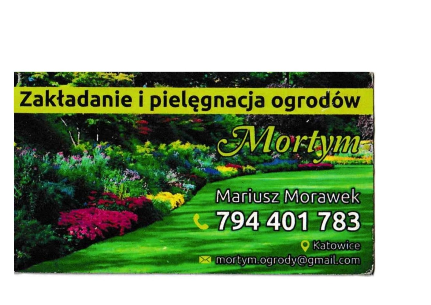 Wizytówka firmy ogrodniczej z Katowic, oferującej zakładanie i pielęgnację ogrodów, z ilustracją bujnej zieleni i kolorowych kwiatów oraz danymi kontaktowymi.