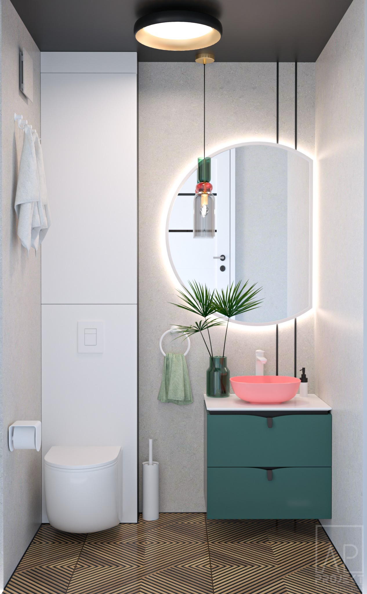 Nowoczesna łazienka z okrągłym lustrem podświetlanym LED, różową umywalką nablatową, zieloną szafką pod umywalką, wiszącą toaletą i drewnianą podłogą ułożoną we wzór jodełki.