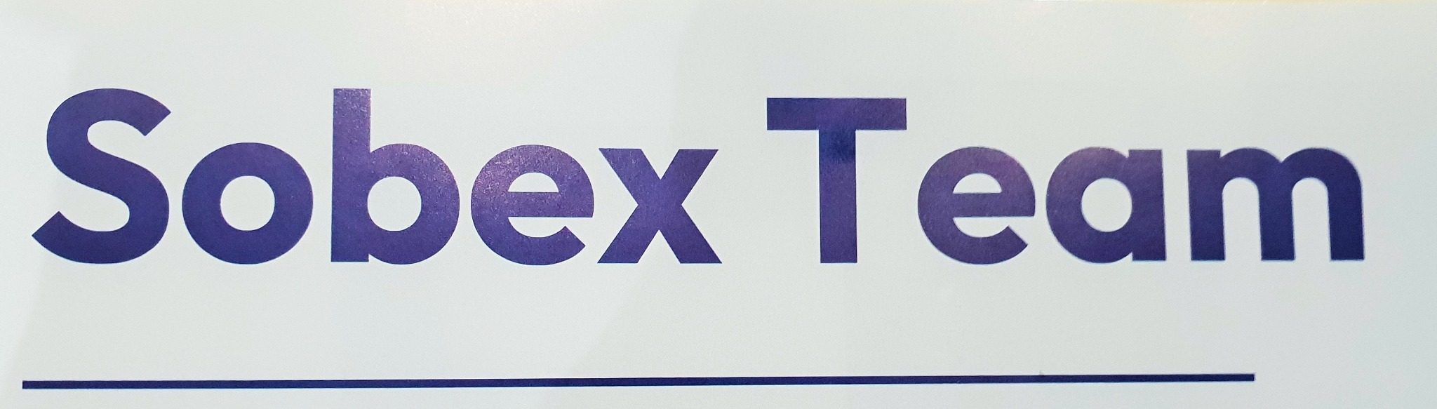 Logo firmy Sobex Team w kolorze fioletowym na białym tle, z podkreśleniem.