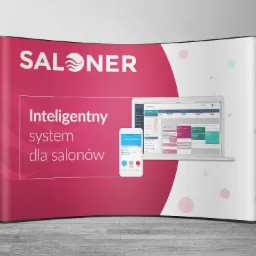 Stoisko reklamowe z hasłem 'Inteligentny system dla salonów' i zrzutami ekranu aplikacji na telefonie i laptopie, prezentujące terminarz i funkcje systemu.