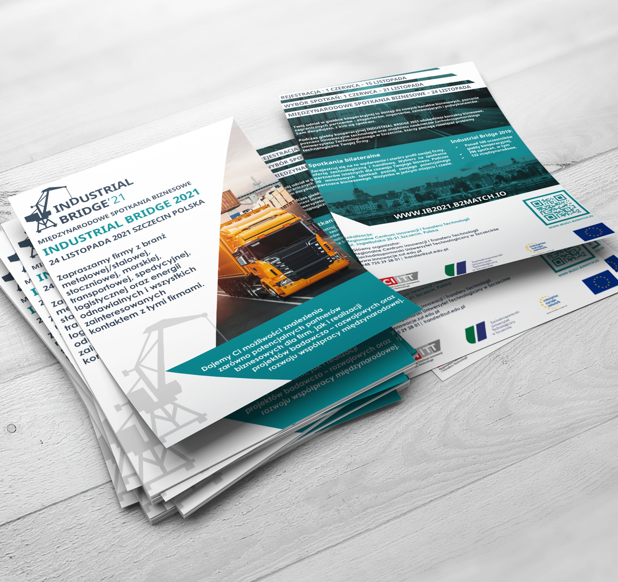 Stos ulotek reklamowych wydarzenia Industrial Bridge 2021, z widocznym motywem ciężarówki i informacji o spotkaniach biznesowych dla branż metalowej, transportowej i logistycznej.