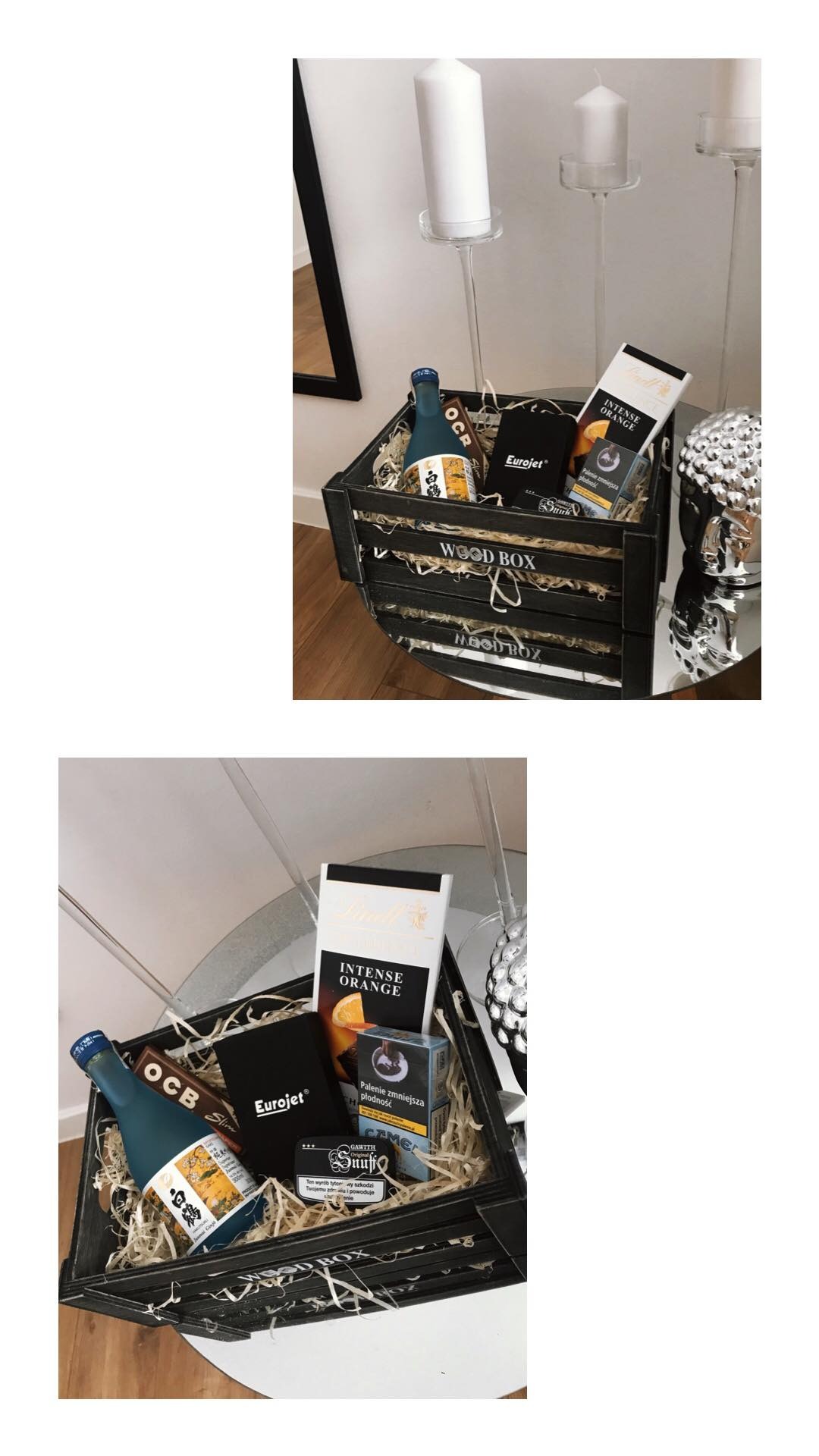 Urodzinowy box prezentowy z Przystajni. W czarnym drewnianym pudełku wypełnionym siankiem znajdują się: butelka, czekolada Lindt Intense Orange, paczka papierosów i inne drobne upominki. W tle...