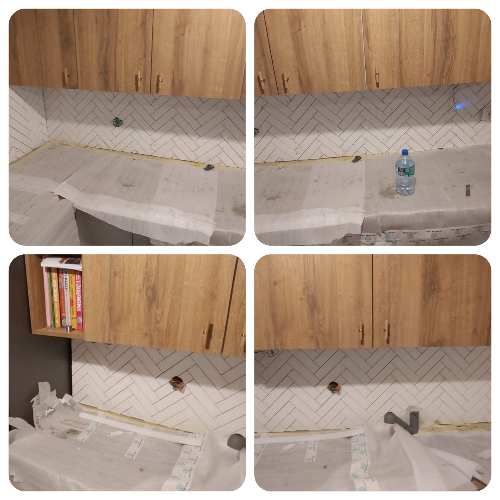 Kuchnia w trakcie remontu: białe płytki ułożone w jodełkę na ścianie, zabezpieczony blat folią ochronną, drewniane szafki wiszące, widoczne otwory na gniazdka elektryczne.