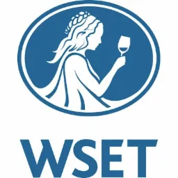Niebieskie logo WSET przedstawiające profil kobiety z kieliszkiem wina w owalu.